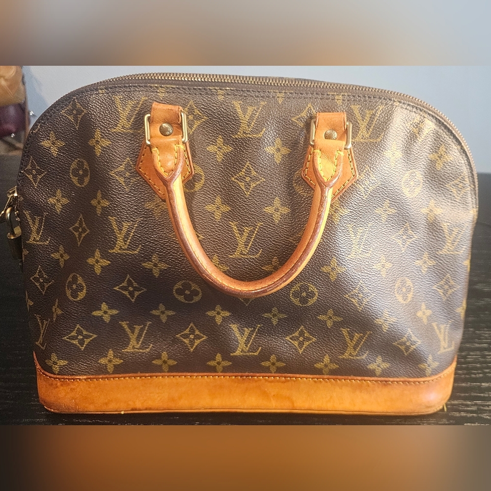 Louis Vuitton Monogram Alma 30 Handbag With LOCK
